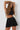 Joy skirt black in model front view close up  -JUV
