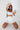 Joy skirt white in model front view -JUV