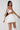 Joy skirt white in model back view -JUV