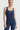 Sleek long jumpsuit blue in model front view - JUV