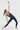 Sleek long jumpsuit blue in model front view - JUV