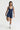 Sleek short jumpsuit dark blue in model front view - JUV