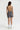 Sleek short jumpsuit gray in model back view - JUV
