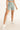 Unicorn short green in model front side view - JUV 